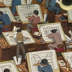 many people sitting at desks with drawings on them