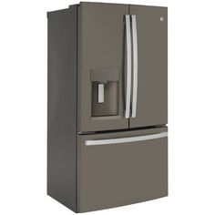 a gray refrigerator freezer sitting next to a white wall with an ice dispenser