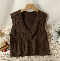 Basic sleeveless v-neck vest with a braided texture in our signature soft knit. One Size: 35.5" chest, 19.5" length Trendy Textured Knit V-neck Sweater Vest, Casual V-neck Cable Knit Sweater Vest, Casual Cable Knit Sleeveless Tank Top, Brown Textured Knit V-neck Top, Knitted V-neck Vest For Spring, Brown Knitted V-neck Top, Spring Knitted V-neck Vest, Casual Sleeveless Brown Sweater, Casual Brown Sleeveless Sweater