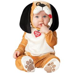 a baby in a dog costume sitting on the floor with his hand under his chin