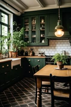 a kitchen filled with lots of green cabinets