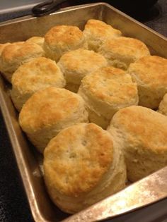 a pan filled with biscuits sitting on top of a counter