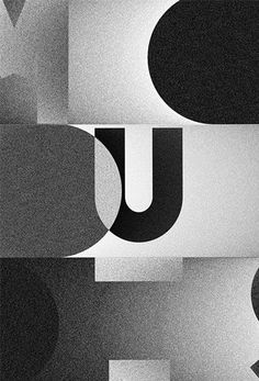 an abstract black and white photo with the letter u