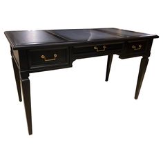 a black desk with two drawers on one end and gold handles on the other side