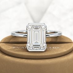 Introducing our stunning 2.50 Carat Emerald Cut Half Bezel Engagement Ring! Crafted with love, this exquisite ring features an emerald cut lab grown diamond set in 14K or 18K yellow gold. Its minimalist design exudes elegance, making it a perfect choice for your proposal. Trust us, this ring will leave her breathless!𝐅𝐞𝐚𝐭𝐮𝐫𝐞𝐬:• 𝐌𝐚𝐝𝐞 𝐭𝐨 𝐎𝐫𝐝𝐞𝐫• 𝐌𝐞𝐭𝐚𝐥: 𝟏𝟒𝐊 𝐆𝐨𝐥𝐝 | 𝟏𝟖𝐊 𝐆𝐨𝐥𝐝 | 𝟗𝟓𝟎 𝐏𝐥𝐚𝐭𝐢𝐧𝐮𝐦 • 𝐁𝐚𝐧𝐝 𝐂𝐨𝐥𝐨𝐫𝐬: Rose Gold, Yellow Gold & White Gold• 𝐁 Classic Rectangular Emerald Ring In White Gold, Classic White Gold Rectangular Emerald Ring, Classic Rectangular White Gold Emerald Ring, Baguette Cut Emerald Ring In Platinum, Elegant Rectangular Emerald Ring Gia Certified, Elegant Rectangular Emerald Ring With Prong Setting, Elegant Gia Certified Emerald Ring Gift, Classic Emerald Cut Lab Grown Diamond Ring, Elegant Gia Certified Rectangular Emerald Ring