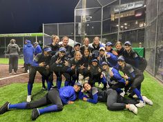 the softball team is posing for a group photo