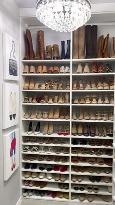 a closet filled with lots of shoes and chandelier