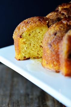 a bundt cake on a white plate with one piece cut out and ready to be eaten