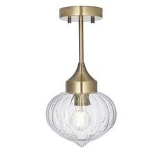 an antique brass ceiling light with clear glass globes on the front and back sides