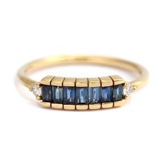 Impressive 18k solid gold ring, set with seven baguette cut blue sapphire gemstones arranged in a horizontal lineup. Beautiful alternative engagement ring for the color loving bride. The design is inspired by the elegant and glamorous art deco style, characterised by smooth lines, geometric shapes and streamlined forms.MATERIALS18k solid gold, seven baguette cut sapphire gemstones 0.5 carat (total), two round cut white diamonds 0.06 carat (total). Ring's width: 1.5 mm.Available in YELLOW, WHITE Mc Bling, Baguette Engagement Ring, Beautiful Baubles, Blue Engagement Ring, Bling Ring, Deco Blue, Ring Sapphire, Baguette Ring, Blue Sapphire Ring