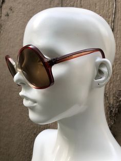 1960-1970's Vintage sunglasses, clear & red ombré acetate frames with deep red/subtle purple arms, brown tinted (high quality) lenses, round shape, oversized fit, made in Greece. Condition is new old stock, but there are signs of age & wear from storage; may need adjustments, wear to finish & residue from adhesive, light scratches. *For 20% off your purchase of 3 or more accessories, clothing items, glasses & shoes, please enter the discount code WARDROBE20 at checkout. Vintage Red Sunglasses With Mirrored Lenses, Jackie O Sunglasses, Butterfly Boho, Clubmaster Sunglasses, Red Ombre, Jackie O, Vintage Sunglasses, 70s Vintage, Accessories Clothing