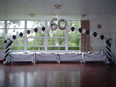 a party room with balloons and decorations