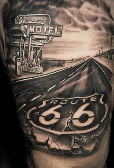 the back of a man's arm with an old route 66 sign on it