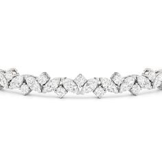 An absolute showstopper, this diamond tennis bracelet will have all eyes on your wrist. It features marquise diamonds and round diamonds arranged in a fanciful pattern to create a row of diamonds with gently undulating arches. This tennis bracelet is lovely on its own, but lovelier when worn with bangles and dainty chains. Luxury Rose Gold Marquise Jewelry, Round Diamond Tennis Bracelet, Expensive Jewelry Luxury, Infinity Pendant, Diamond Bangles Bracelet, Diamond Tennis Bracelet, Jewelry Luxury, Expensive Jewelry, Fancy Color Diamonds