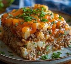 a piece of meat and cheese casserole on a plate