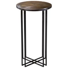 an iron and wood side table with a round wooden top, on a white background