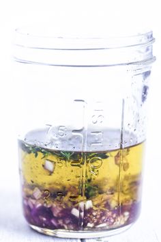 a jar filled with liquid sitting on top of a table