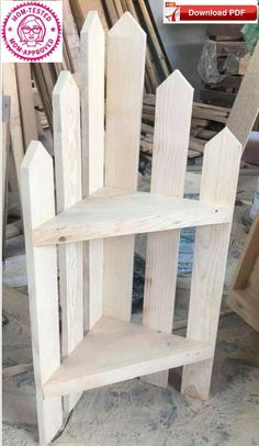 a wooden shelf sitting on top of a floor next to wood planks and plywood