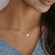 Make a sweet and stylish statement in this glamorous heart necklace. Crafted of 18K white gold, this pave' diamond mini heart necklace floats on an adjustable cable link chain and will send a message of affection to your loved one! Curate an eye-catching statement look by matching this with the other natural beauties from our Diamond Jewelry Collection. Natural Diamonds: 0.20ctw 18K White Gold Length: 18 Inches Mini Heart Necklace, Heart Diamond Necklace, Floating Necklace, Heart Necklace Diamond, Heart Diamond, Mini Heart, Pave Diamonds, Link Chain, Heart Necklace