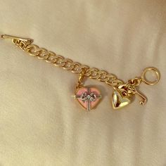 Almost Brand New... Wore It 3 Times. Has A Heart Shaped Pendant That Opens And Has Little Candies In Side. Gift Jeweled Chain Bracelet, Jeweled Chain Bracelet Gift, Gold Charm Bracelet With Jewels For Gift, Elegant Heart-shaped Charm Bracelet For Party, Trendy Heart-shaped Charm Bracelet For Party, Heart Chain Bracelet As Gift, Trendy Charm Bracelet Chain As Gift, Pink Chain Bracelet As A Gift, Metal Charm Bracelet With Heart Charm For Party