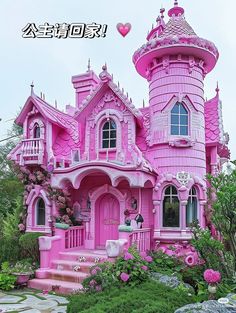 a pink house with lots of windows and turrets on it's roof, surrounded by greenery