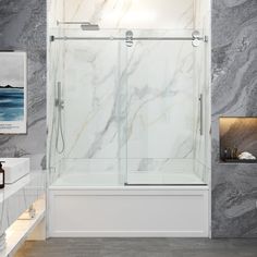 a bathroom with marble walls and flooring