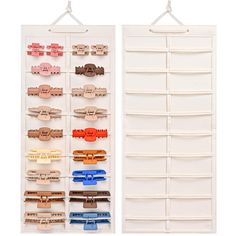 two white wall hangings with different colored clips on each one and the other side