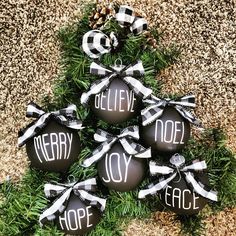 black and white ornaments with merry joy written on them