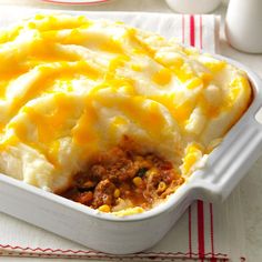 a casserole dish filled with meat and cheese