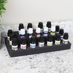 Organize and display your beautiful essential oil collection in a unique and stylish way with the premium Polar Whale Essential Oil Organizer. Includes 1 black high density foam organizer that holds up to 20 essential oil bottles; 15 larger pockets (1.2" wide) comfortably fit bottles up to 15ml, and 5 smaller pockets (0.95" wide) fit 5ml bottles perfectly. Make optimal use of your precious space, while keeping your all of your favorite essential oils organized and within easy reach. Ideal for th Essential Oil Organizer, Essential Oils Organization, Office Elegant, Essential Oils Collection, Green Soap, Essential Oil Storage, Cool Wall Decor, Cosmetic Display, Oil Storage