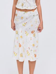 Crafted in an satin, the Charlise white midi skirt features a charming hand-designed print by artist Keely Murphy. Pair this romantic skirt with the Morgan Top for a co-ord skirt set.