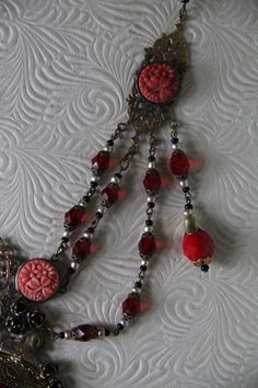 "This listing is for An Art Nouveau Antique 1930's Czech Vibrant Red Color Glass bead, and delicately carved celluloid Festoon Lariat Necklace and Earring Set* A true One of a kind set! The pieces show the patina of time, which makes this a testimonial of a past era. Glamorous and classic chic. Here are the details of this specific gem exactly as shown on pictures: kindly regard that this piece does show wear on the largest glass centerpiece, but otherwise all else is in superb pre_loved conditi Elegant Vintage Collection Jewelry, Antique Red Dangle Jewelry, Red Dangle Jewelry With Bead Caps, Vintage Wedding Jewelry With Dangling Beads, Vintage Red Jewelry With Dangling Beads, Vintage Beaded Lariat Jewelry, Elegant Vintage Jewelry With Round Beads, Vintage Jewelry With Bead Caps And Round Beads, Vintage Jewelry With Dangling Beads For Jewelry Making