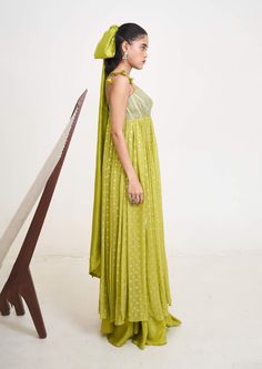 Introducing the emilie anarkali, a masterpiece crafted from the finest georgette and chanderi silk, now available in a captivating lime green hue. This ensemble exudes timeless elegance with its flowing silhouette and exquisite craftsmanship. Elegant Green Gown With Sheer Dupatta, Green Anarkali Palazzo Set With Sheer Dupatta, Green Silk Gown With Traditional Drape, Green Silk Gown For Festive Occasions, Green Silk Anarkali Gown, Green Silk Floor-length Kurta, Green Floor-length Silk Kurta, Elegant Green Floor-length Salwar Kameez, Green Gown With Sheer Dupatta For Designer Wear