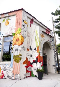 a building painted with flowers and birds on it