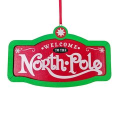 a wooden sign with the words north pole hanging from it's front and side