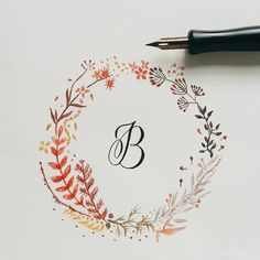 the letter b is surrounded by flowers and leaves