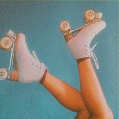 a pair of legs with roller skates attached to them