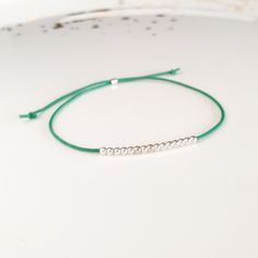 Minimalist, wearable and delicate silver multicolor thread bracelet available in several colors. Length: 20cm adjustable knot. Width: 2mm. Fully adjustable, Handmade in Spain. More colors available in this product => https://www.etsy.com/listing/845364478/tiny-simple-cord-sterling-silver-wish Ideal for a gift and for combinate with other bracelets. All our products are presented in a white organza bag. ♡ Made with love in Valencia ♡ ----------------------------- Discover the NICTE bracelets c Adjustable Friendship Bracelets With Silver Beads As Gift, Minimalist Adjustable Friendship Bracelets, Minimalist Silver Bracelets With Sliding Knot, Silver Minimalist Bracelet With Sliding Knot, Minimalist Silver Bracelet With Sliding Knot, Minimalist Silver Friendship Bracelets With Tiny Beads, Minimalist Silver Friendship Bracelet With Tiny Beads, Minimalist Handmade Friendship Bracelets, Silver Friendship Bracelets With Adjustable Round Beads