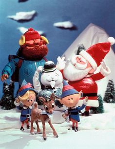 rudolph the red - nosed reindeer is surrounded by elves