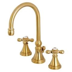 two faucets in gold with white knobs on the handles and side sprayers