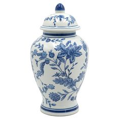 a blue and white vase with flowers on the lid is shown in front of a white background