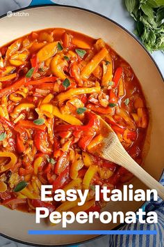 a pan filled with pasta and vegetables on top of a table