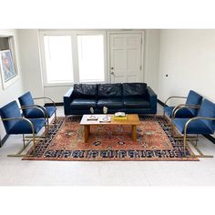 a living room filled with furniture and a rug