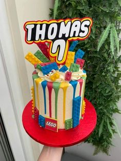 there is a birthday cake with the name thomas on it