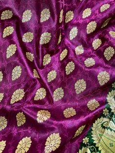 Gorgeous Banarasi Tanchoi Silk Saree. Handpicked from weavers of Banaras. Its a beautiful Half and half saree with Tanchoi and Buttis work on the half of the saree and the other half is just the tanchoi work. Item : SareeColor : Purple with Green with Muted Gold Zari Weave Base Fabric : Banarasi Tanchoi SilkBlouse piece : YesFall & Edging(Pico) Yes/No : Yes Disclaimer -:- Color variation is possible due to various reasons like phone or desktop setting, resolution etc. Please don't hold us respon Brocade Saree With Traditional Patterns For Puja, Brocade Saree With Self Design For Festivals, Festive Banarasi Silk Fabric With Pallu, Festive Banarasi Silk Fabric In Traditional Drape, Art Silk Fabric With Zari Work For Puja, Festive Katan Silk Embroidered Fabric With Self Design, Festive Banarasi Silk Dupatta Fabric, Bollywood Banarasi Silk Fabric With Self Design, Unstitched Brocade Saree With Self Design