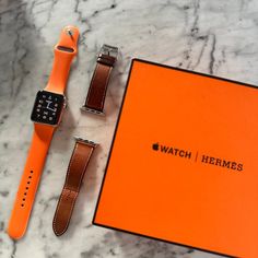 This Hermes Apple Watch Is Super Versatile And Timeless. The Perfect Mix Of Sporty And Classic. You Can Wear It For Your Workouts / Athletic Activities With The Distinguished Hermes Orange Band And You Can Switch It Up For A More Classic Look With The Luxurious Brown Leather Band. This 42mm 2nd Generation Hermes Apple Watch Comes With All Of The Original Packaging And Parts: Two Bands (Orange Rubber And Brown Leather), The Original Hermes Orange Box And White Watch Box + Apple Watch Charger. Not Hermes Apple Watch, Apple Watch Charger, Orange Box, Hermes Orange, Apple Watch 42mm, Apple Watches, Watch Charger, Hermes Accessories, White Watch