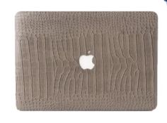 an apple macbook air case with crocodile skin on the front and back cover in light brown