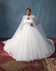 a woman in a white wedding gown and veil