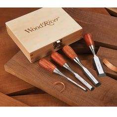 five wooden carving tools in a box on top of a cutting board with the word woodreger written on it