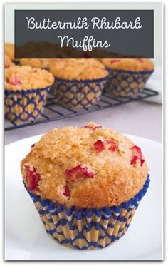 a muffin on a plate with the words buttermilk rhubart muffins